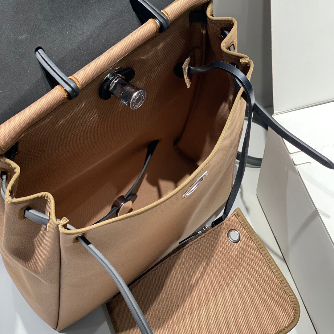 HERBAG A DOS ZIP RETOURNE BACKPACK 29 IN BROWN CANVAS AND BLACK CALFSKIN