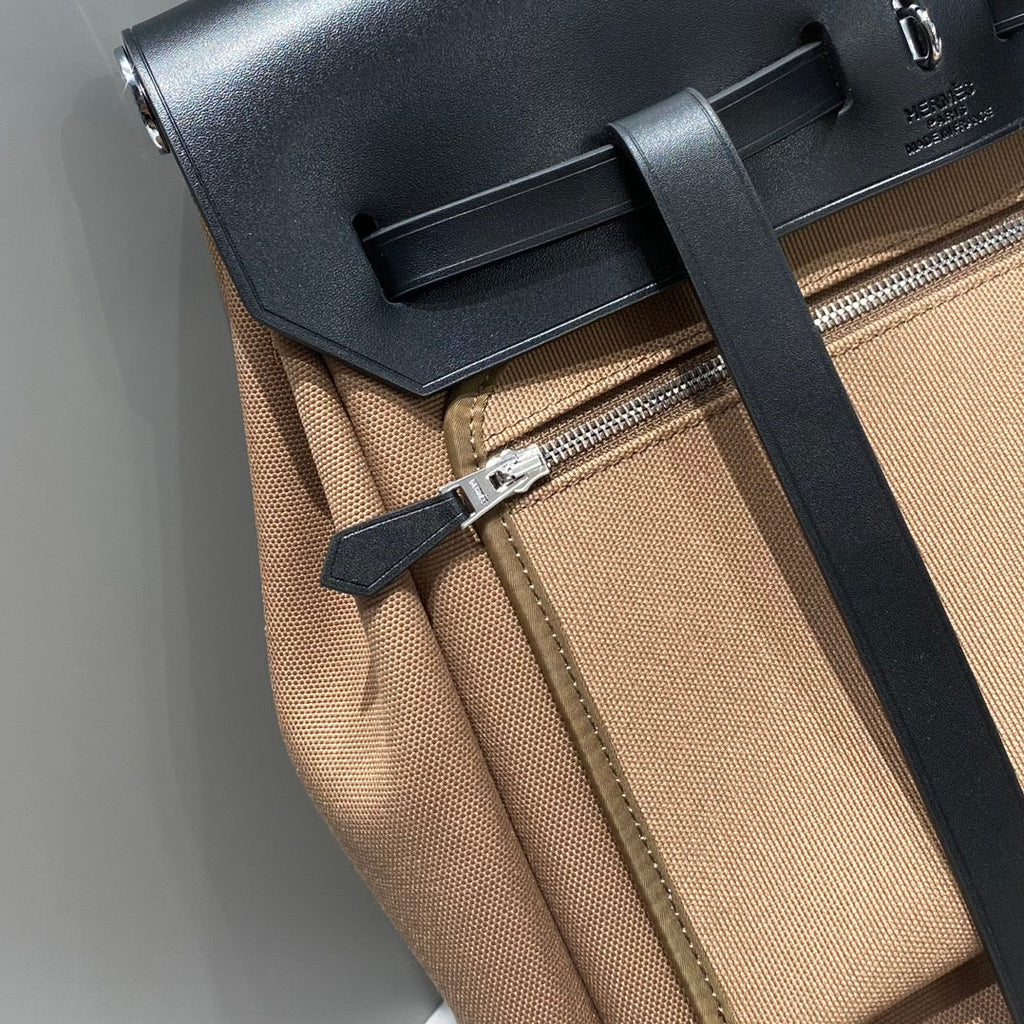 HERBAG A DOS ZIP RETOURNE BACKPACK 29 IN BROWN CANVAS AND BLACK CALFSKIN