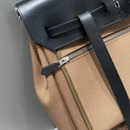 HERBAG A DOS ZIP RETOURNE BACKPACK 29 IN BROWN CANVAS AND BLACK CALFSKIN